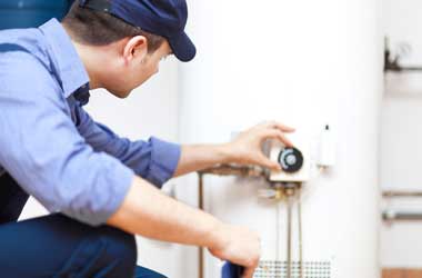 Houston Plumber Checking the Thermostat