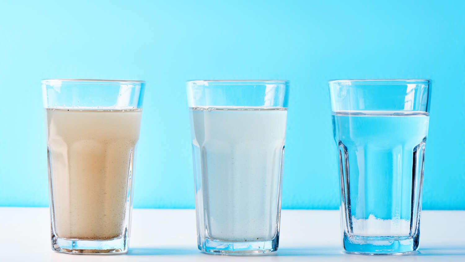 3 glasses with water from dirt to clean